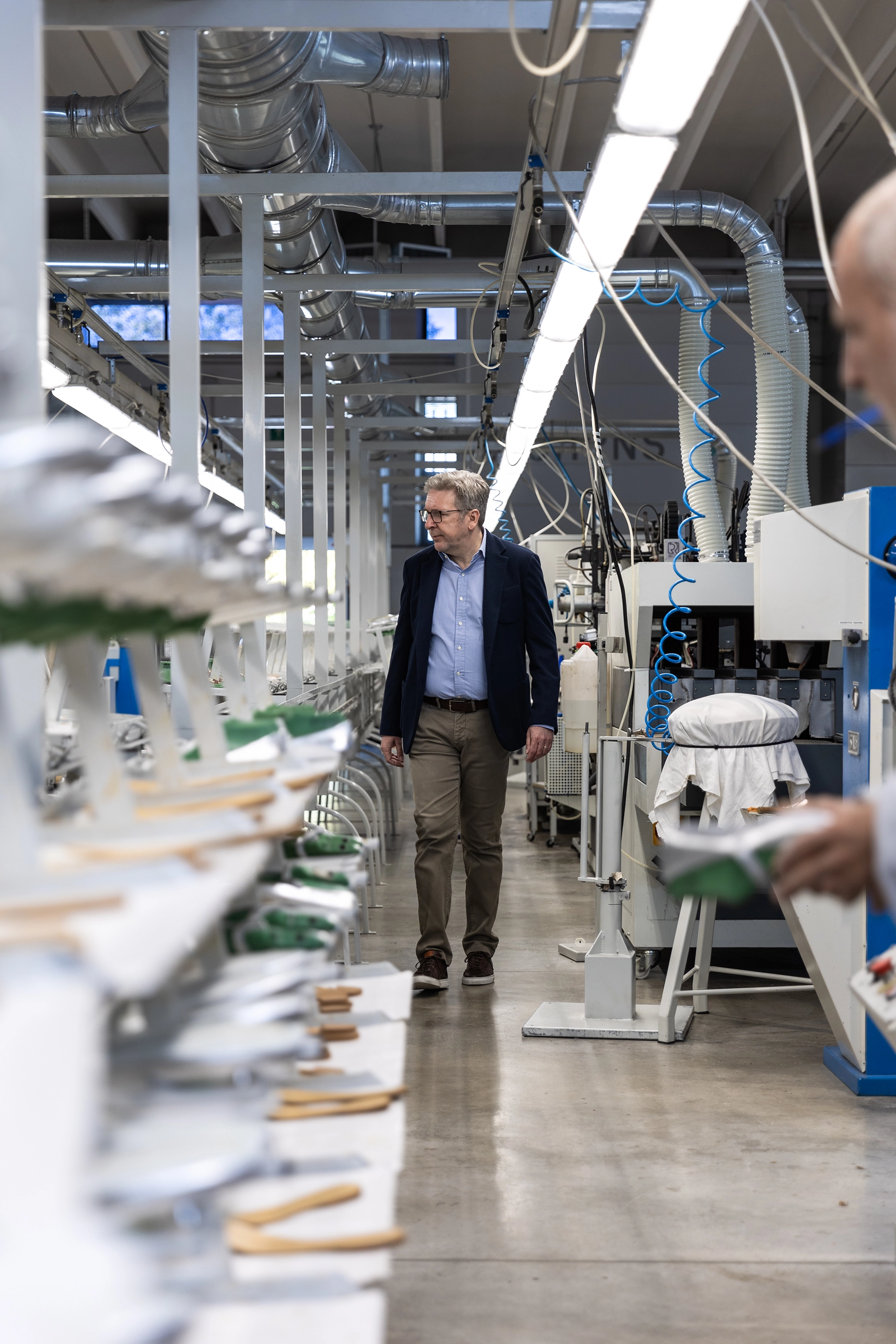 Domenico inspecting the production department of a shoe factory