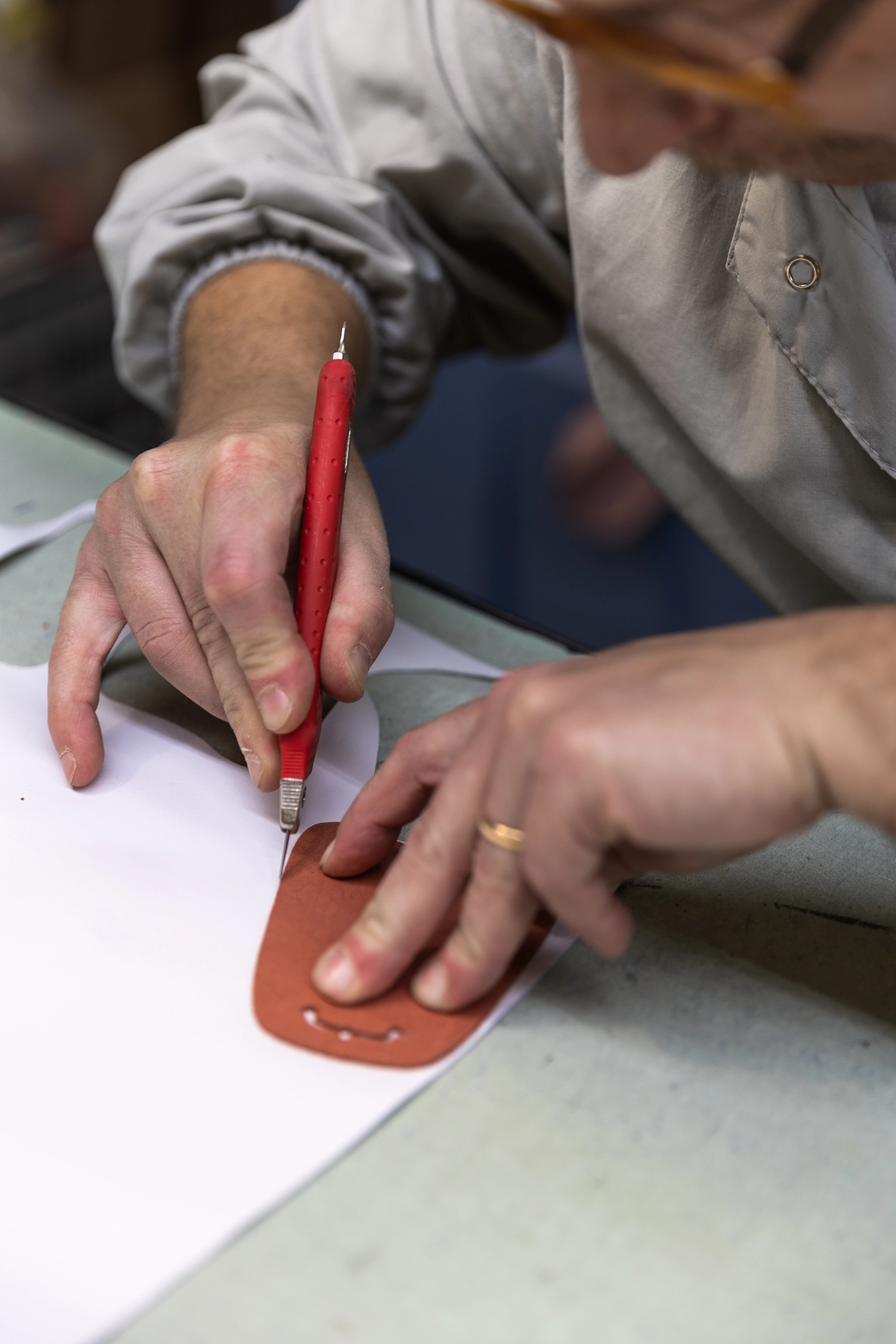 A leather cutter at work